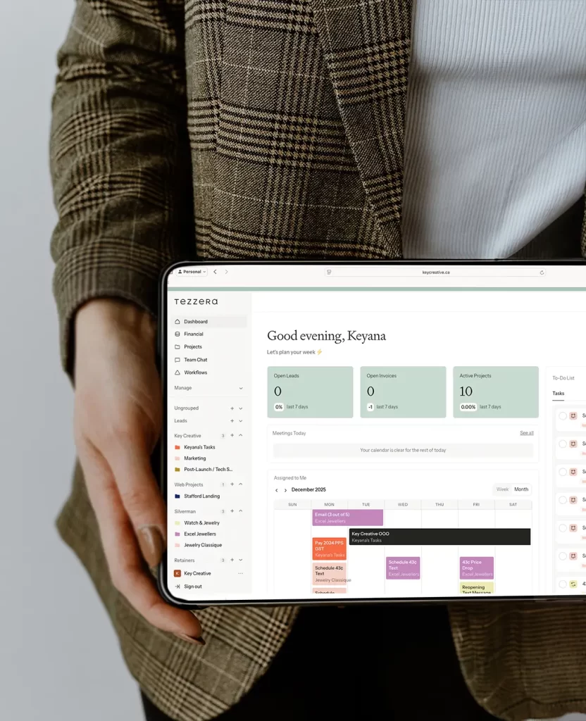 Holding an ipad with Tezzera CRM on the screen